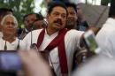 Former Sri Lankan president Rajapaksa speaks to his   supporters at his residence in Medamulana