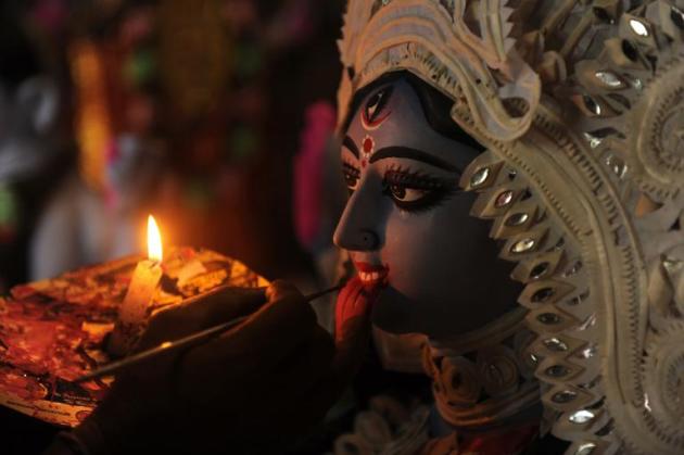 An Indian artist works on a clay statue of Kali -- the Hindu goddess of power.