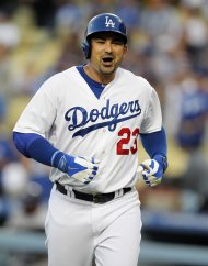 Los Angeles Dodgers’ Adrian Gonzalez leaves the batter's box after hitting a solo home run against the Colorado Rockies in the first inning of a baseball game Saturday, Sept. 27, 2014, in Los Angeles. (AP Photo/Alex Gallardo)