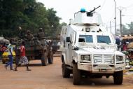 Rwandan police with the MINUSCA peacekeeping force patrol Bangui's Combattant district on September 14, 2015