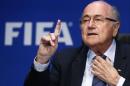 Re-elected FIFA President Blatter gestures during a   news conference after an extraordinary Executive Committee meeting in Zurich