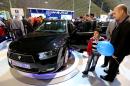 Visitors look at the new sedan Dena, manufactured by Iran's automaker Iran Khodro, during the International Car Exhibition in the northern city of Tabriz on October 14, 2014