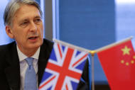 Britain's Chancellor of the Exchequer Philip Hammond attends the UK-China High Level Financial Services Roundtable at the Bank of China head office building in Beijing, China, Friday, July 22, 2016. (Damir Sagolj/Pool Photo via AP)