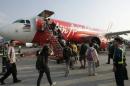 Passengers board an AirAsia Airbus A320 plane at the   domestic airport in Manila