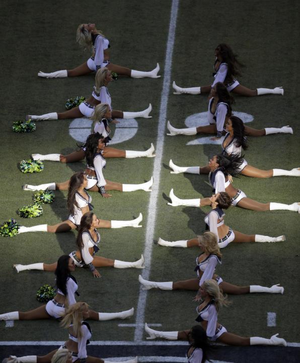 Seattle Seahawks Sea Gals cheerleaders perform before the start of an NFL football game between the Seattle Seahawks and the Green Bay Packers, Thursday, Sept. 4, 2014, in Seattle. (AP Photo/Scott Ekl