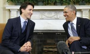 U.S. President Obama and Canadian Prime Minister Trudeau laugh as they meet in the Oval Office following an official arrival ceremony for Trudeau at the White House in Washington