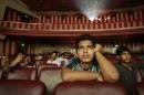 Ram Pratap Verma, a 32-year-old aspiring Bollywood   film actor, watches a film at a cinema in Mumbai