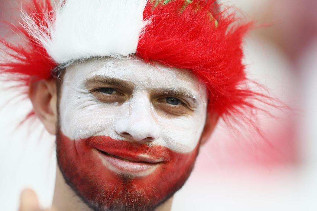 Poland fan with face paint before the game