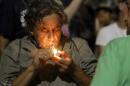 A man lights to smoke marijuana as marijuana   enthusiasts gather after midnight to celebrate the legalization of recreational   use of marijuana in Portland