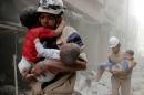 Members of the Civil Defence rescue children after   what activists said was an air strike by forces loyal to Syria's President   Assad in al-Shaar neighbourhood of Aleppo