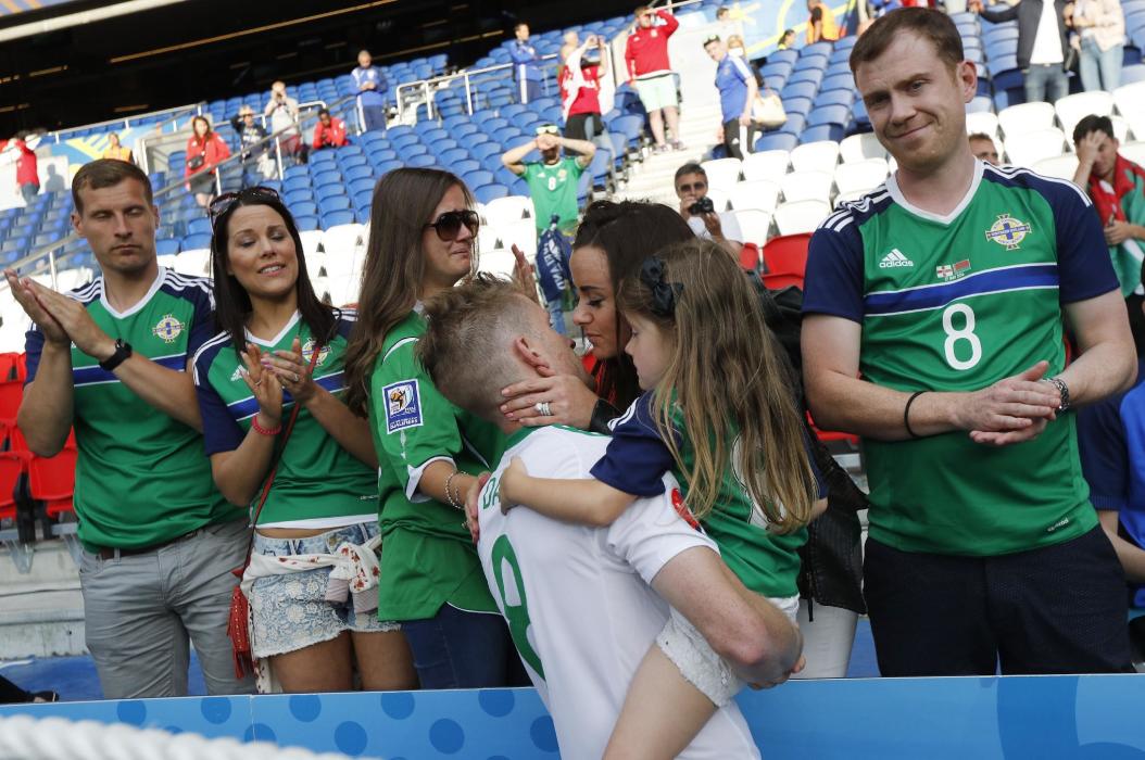 Northern Ireland's Steven Davis with family and fans after the game