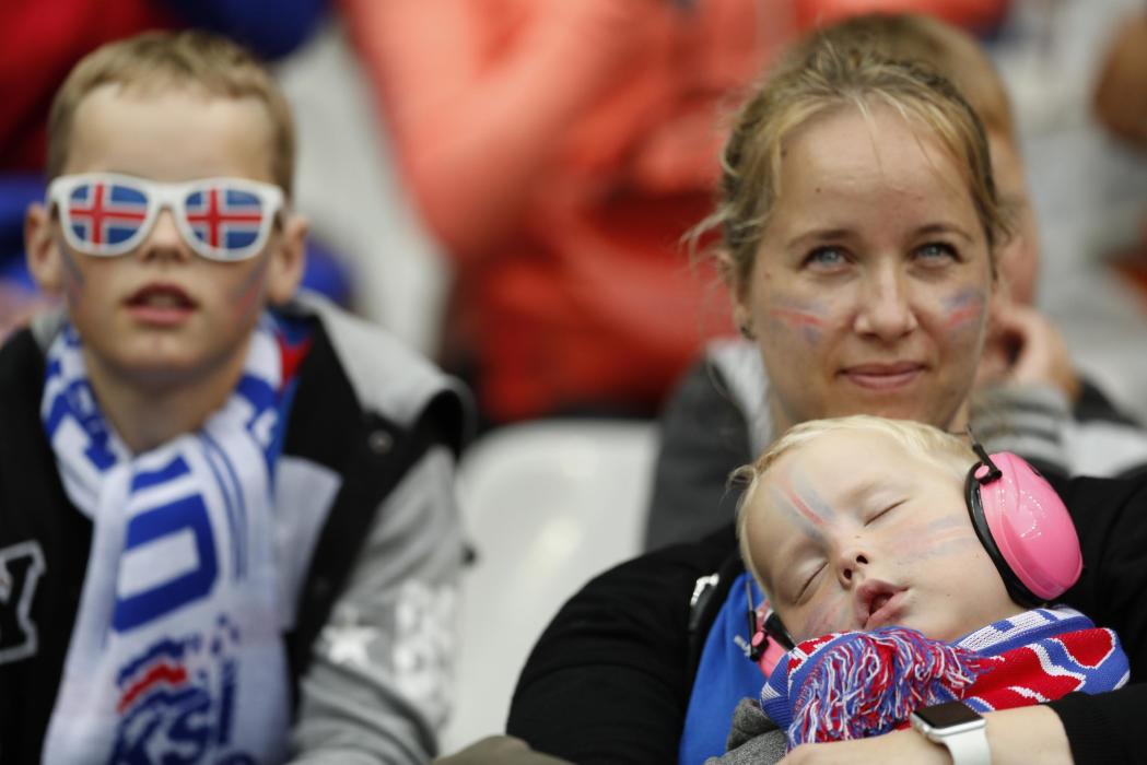 Iceland fan with a baby before the game