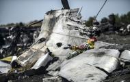 Flowers left by the parents of an Australian passenger are seen on the wreckage of the Malaysia Airlines MH17 near the village of Hrabove (Grabove) in the Donetsk region on July 26, 2014