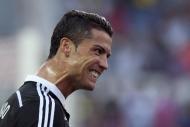 El portugués Cristiano Ronaldo, del Real Madrid, celebra uno de sus tres goles ante el Sevilla (3-2), el 2 de mayo de 2015, en el estadio Sánchez Pizjuán, en Sevilla (AFP | Jorge Guerrero)