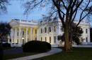 The White House is seen at dusk in Washington, Wednesday, Nov. 19, 2014. President Barack Obama on Thursday is expected to announce steps he will take to shield up to 5 million immigrants illegally in the United States from deportation. (AP Photo/Jacquelyn Martin)