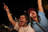 Opposition supporters shout while they celebrate their victory on a street in Caracas December 7, 2015. REUTERS/Nacho Doce