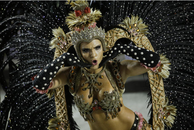 A performer from the Salgueiro samba school parades during carnival celebrations at the Sambadrome in Rio de Janeiro, Brazil, Monday, Feb. 16, 2015. (AP Photo/Felipe Dana)