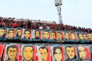 Portraits des victimes des émeutes entre supporteurs en 2012 à Port Saïd, affichés le 1er février 2014 dans le stade Mokhtar El-Tetsh au Caire