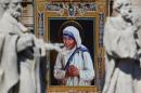 A tapestry depicting Mother Teresa of Calcutta is   seen in the facade of Saint Peter's Basilica during a mass, celebrated by   Pope Francis, for her canonisation in Saint Peter's Square at the Vatican