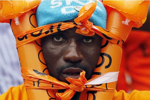 An Ivory Coast fan waits for the start of the African Nations Cup final soccer match between Ghana and Ivory Coast in Bata