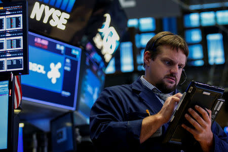 A trader works on the floor of the NYSE in New York