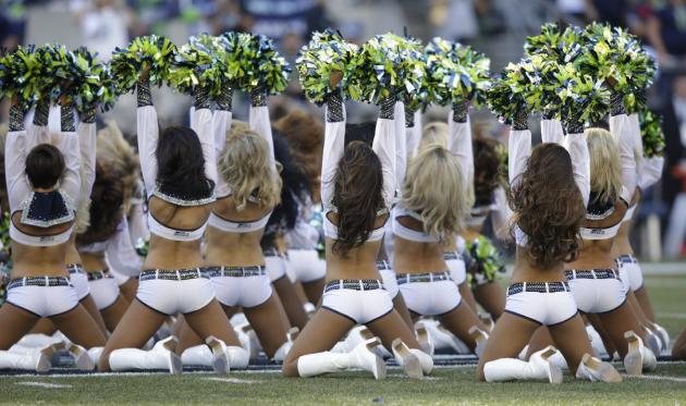 Seattle Seahawks Sea Gals cheerleaders perform in the first half of an NFL football game between the Seattle Seahawks and the Green Bay Packers, Thursday, Sept. 4, 2014, in Seattle. (AP Photo/Stephen 