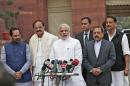 Modi speaks to the media upon his arrival on the opening day of the winter session of the Indian Parliament in New Delhi