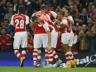 Arsenal's players celebrate the goal of Alexis Sanchez, right, during the English League Cup soccer match between Arsenal and Southampton at Emirates Stadium in London, Tuesday, Sept. 23, 2014. (AP Photo/Kirsty Wigglesworth)