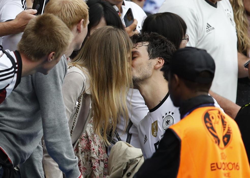 Germany's Mats Hummels with his partner Cathy Fischer at the end of the game