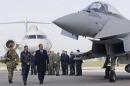 Britain's Prime Minister David Cameron looks at   an RAF Eurofighter Typhoon fighter jet during his visit to Royal Air Force station   RAF Northolt in London