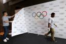 Staff of the IOC dismantle a backdrop after a news   conference after the Olympic Summit on doping in Lausanne