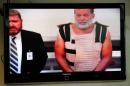 Accused Planned Parenthood gunman Robert Lewis Dear   (R) appears in court with public defender Dan King by video link from jail in   Colorado Springs