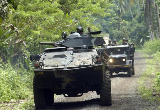 A Philippine military convoy on the lookout for Abu Sayyaf militants, patrols the southern island of Jolo, on June 26, 2007