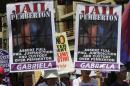 Activists display placards of U.S. Marine Private   First Class Joseph Scott Pemberton during a protest outside the presidential   palace in Manila