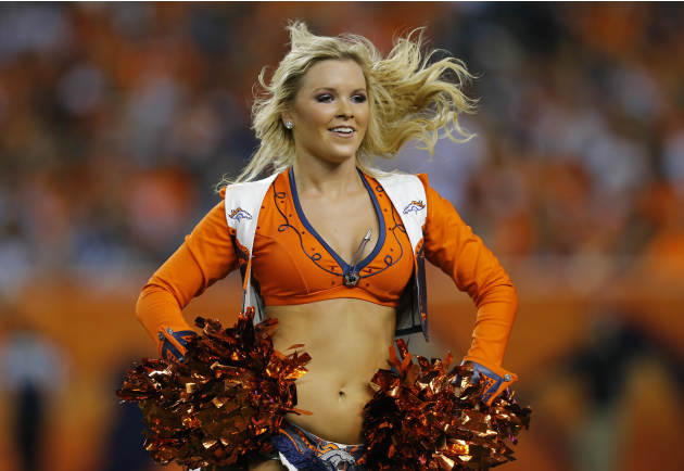 A Denver Broncos cheerleader performs during the second half of an NFL football game against the Indianapolis Colts, Sunday, Sept. 7, 2014, in Denver. (AP Photo/Jack Dempsey)