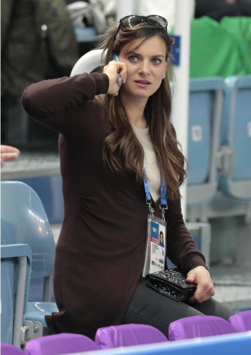 Retired Russian pole vaulter Yelena Isinbayeva attends the figure skating competition at the Iceberg Skating Palace during the 2014 Winter Olympics, Sunday, Feb. 9, 2014, in Sochi, Russia