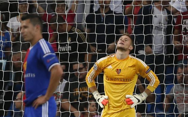 Basel's goalkeeper Vaclik and Suchy react after conceding Real Madrid's fourth goal during their Champions League soccer match in Madrid