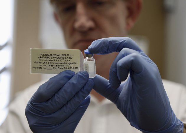 Professor Adrian Hill, Director of the Jenner Institute, and Chief Investigator of the trials, holds a phial containing the Ebola vaccine at the Oxford Vaccine Group Centre for Clinical Vaccinology and Tropical Medicine (CCVTM) in Oxford, southern England September 17, 2014. The first volunteer in a fast-tracked British safety trial of an experimental Ebola vaccine made by GlaxoSmithKline received the injection on Wednesday, trial organizers said. REUTERS/Steve Parsons/Pool (BRITAIN - Tags: HEALTH SCIENCE TECHNOLOGY TPX IMAGES OF THE DAY)