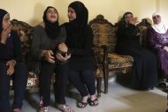 Wife (2nd L) of Lebanese soldier Ali al-Sayyed, who was beheaded by Islamic State militants, mourns with relatives in the town of Fnideq, northern Lebanon August 29, 2014. REUTERS/Stringer