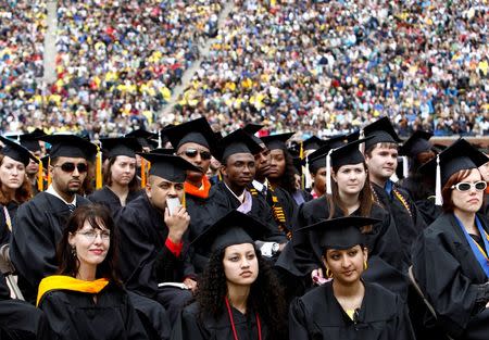 Graduating students listen to U.S. President Barack Obama speak at the University of Michigan commencement ceremony in Ann Arbor, Michigan May 1, 2010. REUTERS/Kevin Lamarque