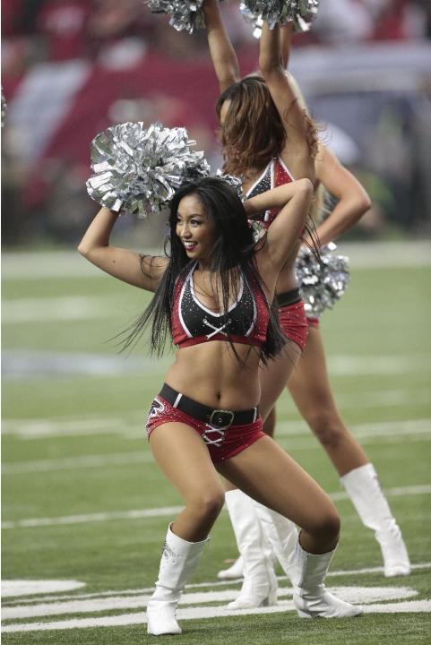 Atlanta Falcons cheerleaders perform during the second half of an NFL football game against the New Orleans Saints, Sunday, Sept. 7, 2014, in Atlanta. (AP Photo/John Bazemore)