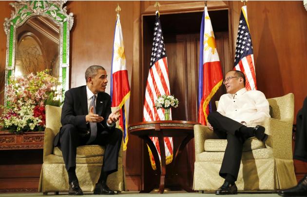 U.S. President Obama talks with President Aquino of the Philippines at the Malacanang Palace in Manila