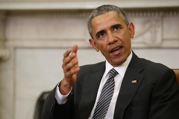 WASHINGTON, DC - FEBRUARY 17: U.S. President Barack Obama (C) talks to reporters at the end of a meeting with newly sworn-in Defense Secretary Ashton Carter in the Oval Office at the White House February 17, 2015 in Washington, DC. Obama said he rejects a federal judge's last-minute ruling that halts his executive order on immigration and said his administration will appeal. "The law is on our side and history is on our side," Obama said. (Photo by Chip Somodevilla/Getty Images)