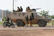 An armoured vehicle is deployed during a sweep operation in an area near the military barracks of the elite presidential guard, in Ouagadougou on September 30, 2015
