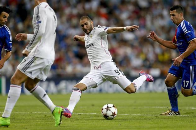 GRA610. MADRID. 16/09/2014.- El delantero francés del Real Madrid Karim Benzemá (c) lanza a puerta para conseguir el quinto gol del equipo, durante el partido de la primera jornada de la fase de grupo