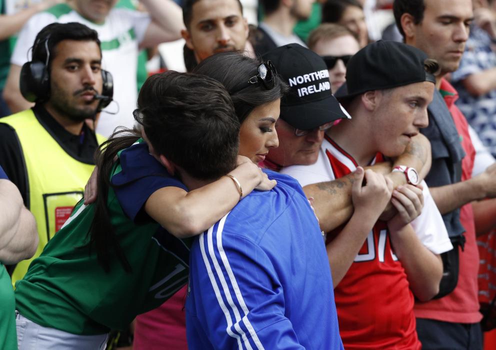 Northern Ireland's Kyle Lafferty with girlfriend Vanessa Chung after the game