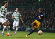 Salzburg's Brazilian forward Alan (R) scores during the UEFA Europa League group D football match between Celtic and FC Salzburg in Glasgow on November 27 , 2014