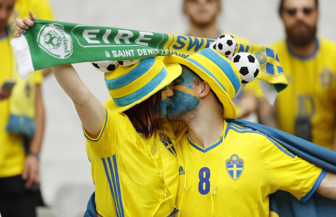 Sweden fans kiss before the match