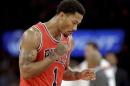 Chicago Bulls' Derrick Rose (1) reacts to a play during the second half of an NBA basketball game against the New York Knicks, Wednesday, Oct. 29, 2014, in New York