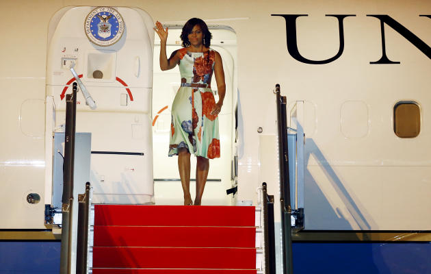 U.S. first lady Michelle Obama arrives at Siem Reap International Airport on Friday, March 20, in Siem Reap, Cambodia. Mrs. Obama's Friday evening arrival in Cambodia comes after a three-day visit to Japan. (AP Photo/Wong Maye-E)